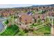 Aerial view of homes with manicured lawns in a suburban neighborhood with mountain views at 5781 S Union Ter, Littleton, CO 80127