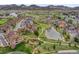 Scenic aerial view of a neighborhood with a pond, park, and sidewalks throughout at 5781 S Union Ter, Littleton, CO 80127