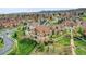Wide aerial view of homes in a community with mature trees and landscaped yards at 5781 S Union Ter, Littleton, CO 80127