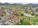 Scenic aerial view of neighborhood featuring tree-lined streets, a pond, and lush green spaces at 5781 S Union Ter, Littleton, CO 80127