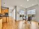 Dining area with hardwood floors, a glass table, and large windows providing pleasant neighborhood views at 5781 S Union Ter, Littleton, CO 80127