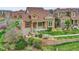 Beautiful two-story home with manicured lawn, stone accents, and tidy landscaping at 5781 S Union Ter, Littleton, CO 80127