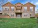 Well maintained exterior home view with grass lawn and combination brick/vinyl siding at 5781 S Union Ter, Littleton, CO 80127