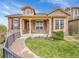 Inviting home exterior with a landscaped front yard, stone accents, and a charming walkway to the front door at 5781 S Union Ter, Littleton, CO 80127
