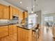 Well-equipped kitchen features a large island, granite countertops, and stainless steel appliances at 5781 S Union Ter, Littleton, CO 80127