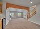 Open-concept living room with carpet, a fireplace, staircase and built-in bar area for entertaining at 5781 S Union Ter, Littleton, CO 80127