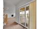 View through a sliding glass door to a living room with a fireplace and neutral color palette at 5781 S Union Ter, Littleton, CO 80127