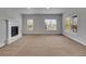 Bright living room with a fireplace and large windows offering ample natural light and outside views at 5781 S Union Ter, Littleton, CO 80127