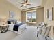 Spacious main bedroom with a tray ceiling, large windows, and seating area at 5781 S Union Ter, Littleton, CO 80127