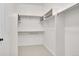 Bright, neutral walk-in closet with shelving and bars for optimal storage and organization at 5781 S Union Ter, Littleton, CO 80127
