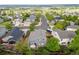 An aerial view of a neighborhood featuring a two-story home with manicured lawn and inviting outdoor patio area at 16839 Trail View Cir, Parker, CO 80134