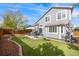 A home with a well-manicured yard, patio set, and ample space for outdoor activities at 16839 Trail View Cir, Parker, CO 80134