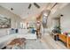 Bright living room with large windows, vaulted ceilings, and hardwood floors at 16839 Trail View Cir, Parker, CO 80134