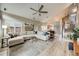 Bright living room with large windows, vaulted ceilings, and hardwood floors at 16839 Trail View Cir, Parker, CO 80134