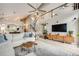 Spacious living room featuring vaulted ceilings, a fireplace, and an open floor plan at 16839 Trail View Cir, Parker, CO 80134