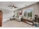 Cozy living room with hardwood floors, ceiling fan, and plenty of natural light at 16839 Trail View Cir, Parker, CO 80134