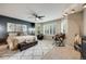 Large bedroom featuring neutral colors, ceiling fan and desk area at 16839 Trail View Cir, Parker, CO 80134