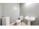 This powder room features a sleek pedestal sink and a modern, efficient toilet at 16839 Trail View Cir, Parker, CO 80134