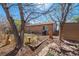An inviting backyard with mature trees, a patio, and a storage shed, perfect for outdoor entertaining at 20137 E Prentice Pl, Centennial, CO 80015