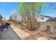Beautiful backyard featuring lush greenery, a well-maintained lawn, and a charming patio area at 20137 E Prentice Pl, Centennial, CO 80015
