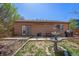 Private backyard includes a patio area, lush landscaping, and a water feature creating a peaceful retreat at 20137 E Prentice Pl, Centennial, CO 80015
