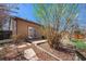 The backyard features a patio, walkway, water fountain, and mature trees providing privacy and shade at 20137 E Prentice Pl, Centennial, CO 80015