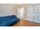 Bedroom with wood floors, closet, and a comfortable futon at 20137 E Prentice Pl, Centennial, CO 80015