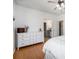 Bright primary bedroom with wood floors, ceiling fan, and a walk-in closet at 20137 E Prentice Pl, Centennial, CO 80015