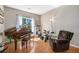 Cozy living room featuring hardwood floors, natural light, and comfortable furniture at 20137 E Prentice Pl, Centennial, CO 80015