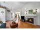 Cozy living room featuring a fireplace, hardwood floors, and comfortable seating at 20137 E Prentice Pl, Centennial, CO 80015