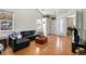 Spacious living room with hardwood floors, vaulted ceilings, and an abundance of natural light at 20137 E Prentice Pl, Centennial, CO 80015