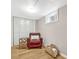 Cozy basement space with ample storage, a comfy chair, and natural light at 4720 W 39Th Ave, Denver, CO 80212