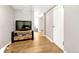 Finished basement area with stylish wooden floors, media center, and white door at 4720 W 39Th Ave, Denver, CO 80212