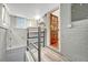 Finished basement with painted brick, wooden door, and plank flooring at 4720 W 39Th Ave, Denver, CO 80212
