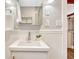 Bright bathroom with modern sink and vanity, complemented by wainscoting details at 4720 W 39Th Ave, Denver, CO 80212