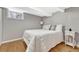 Basement bedroom featuring a comfortable bed, side table, and natural light at 4720 W 39Th Ave, Denver, CO 80212