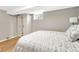 Cozy bedroom with hardwood floors, wardrobe, and natural light from a window at 4720 W 39Th Ave, Denver, CO 80212