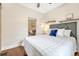 Comfortable bedroom with hardwood floors, neutral decor, and a view into the adjoining living area at 4720 W 39Th Ave, Denver, CO 80212