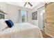 Cozy bedroom featuring a ceiling fan, hardwood floors, and a window offering natural light at 4720 W 39Th Ave, Denver, CO 80212
