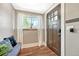 Welcoming entryway featuring a window with curtains and a cozy bench at 4720 W 39Th Ave, Denver, CO 80212