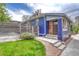 Charming blue bungalow with a well-manicured lawn and a quaint fenced yard at 4720 W 39Th Ave, Denver, CO 80212