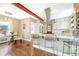Stylish kitchen featuring a center island, modern appliances, and an open-concept design with a dining area at 4720 W 39Th Ave, Denver, CO 80212