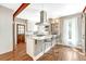Bright, updated kitchen featuring stainless steel appliances and a stylish center island at 4720 W 39Th Ave, Denver, CO 80212