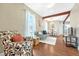 Bright living room featuring hardwood floors and an open floorplan to the dining area at 4720 W 39Th Ave, Denver, CO 80212