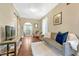 Inviting living room with hardwood floors, a cozy seating area, and natural light at 4720 W 39Th Ave, Denver, CO 80212