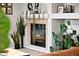 Cozy fireplace adorned with plants and decorative items, creating a warm ambiance at 5535 S Rome St, Aurora, CO 80015