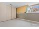 Simple bedroom with closet and neutral walls at 12780 E Bethany Pl, Aurora, CO 80014