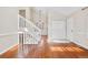 Bright entryway with hardwood floors and staircase at 12780 E Bethany Pl, Aurora, CO 80014