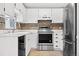 Kitchen with stainless steel appliances and white cabinets at 12780 E Bethany Pl, Aurora, CO 80014