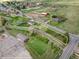 Aerial view highlighting the land, property lines, and neighborhood amenities in a green setting at 4972 Easley Rd, Golden, CO 80403